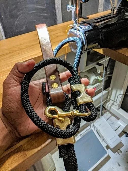 Climbing rope leash with solid brass fittings and custom leather handle